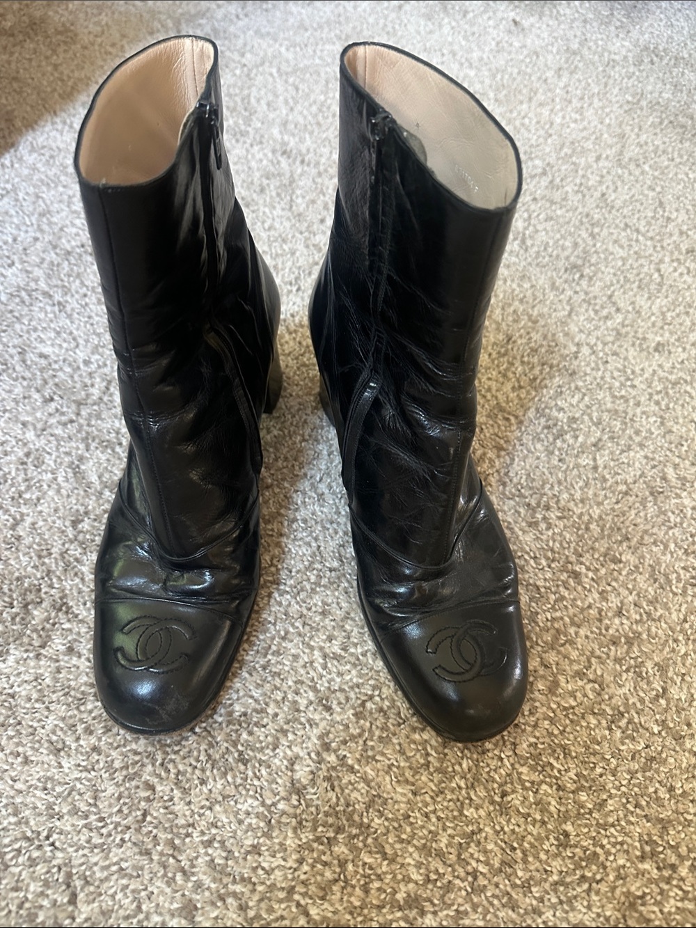 CHANEL Black Leather Ankle Boots with Embossed CC